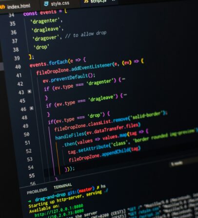JavaScript code editor open with drag-and-drop script on screen.